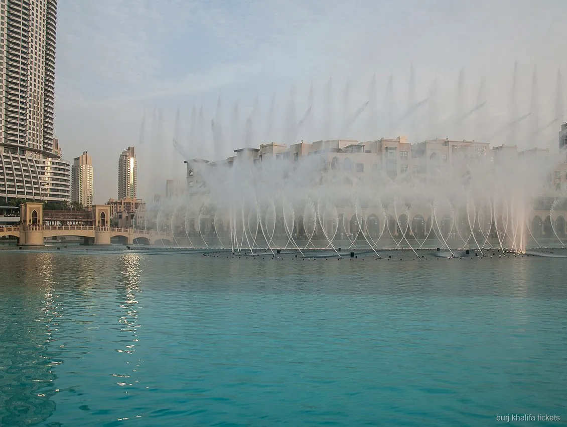 Passengers on the Burj Lake ride ticket watching the fountain show